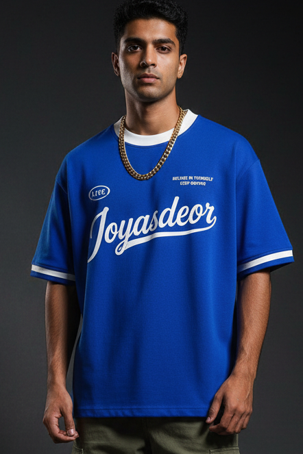 The Live Tee — Front, Styled with Cargo Pants